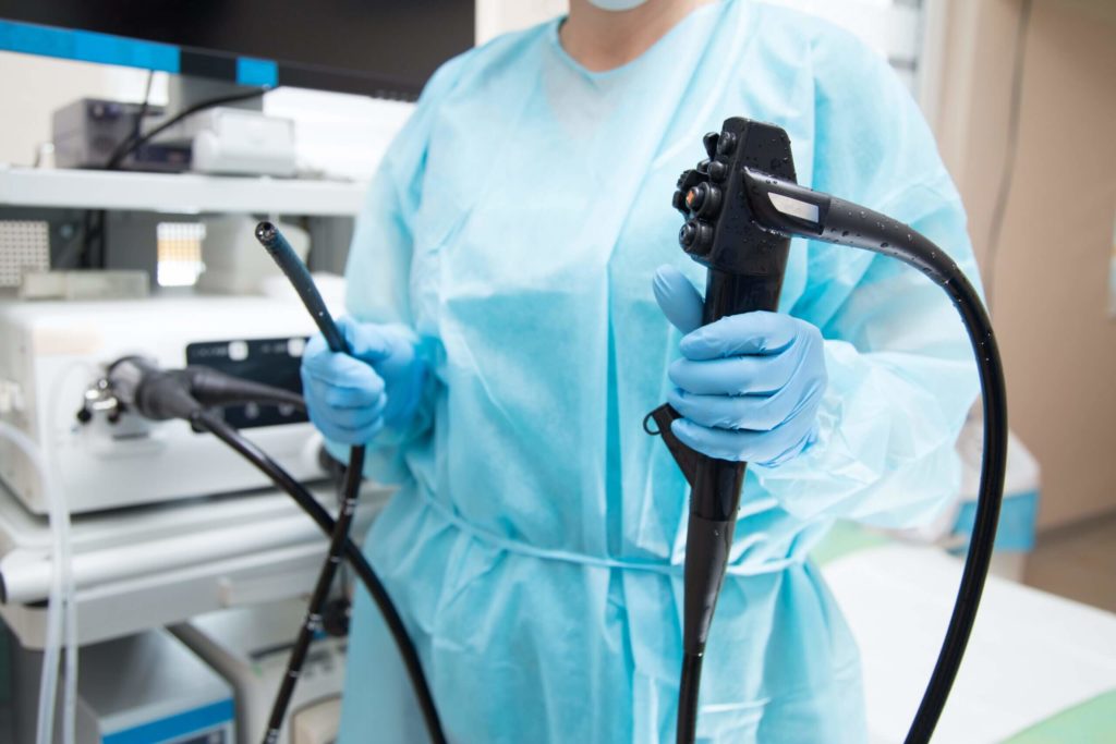 Gastroenterologist Holding Endoscope Preparing for Colonoscopy
